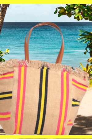 Grote beige strandtas met roze gele en zwarte strepen en leren handvatten